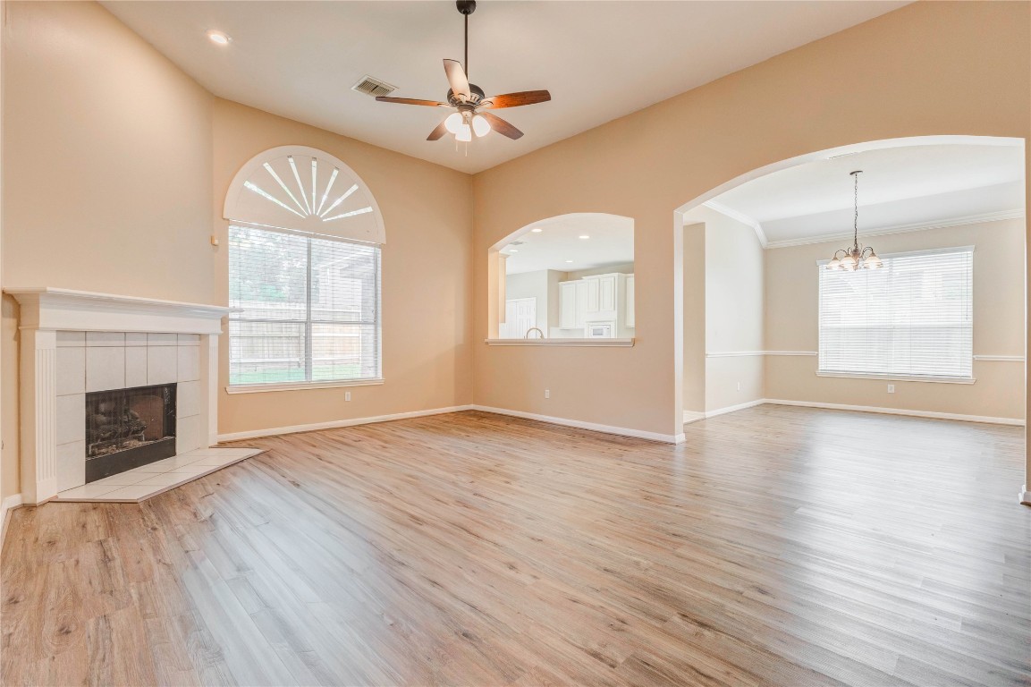 19607 Water Point Trail Humble, TX 77346 - Photo 6 of 32 Open-concept living area with arched openings and natural light throughout.