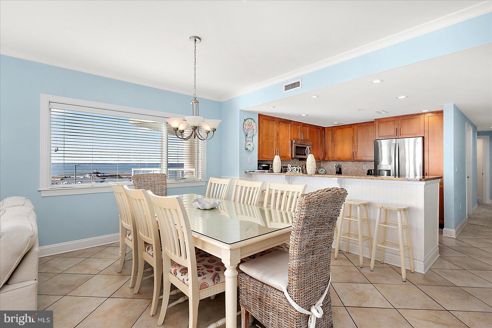 8 60th Street, Unit 902 Ocean City, MD 21842 - Photo 20 of 67 a view of a dining room with furniture