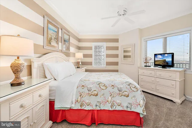 a dining room with furniture a chandelier and wooden floor