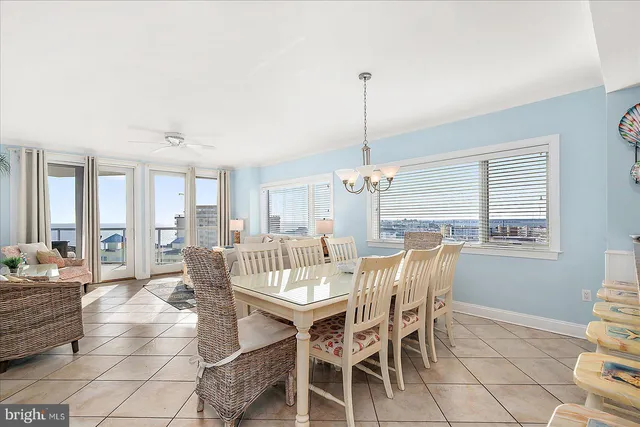 a spacious bedroom with a bed a mirror and lamp