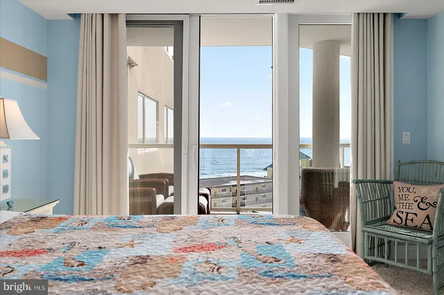 a bathroom with a granite countertop sink a mirror and a bathtub