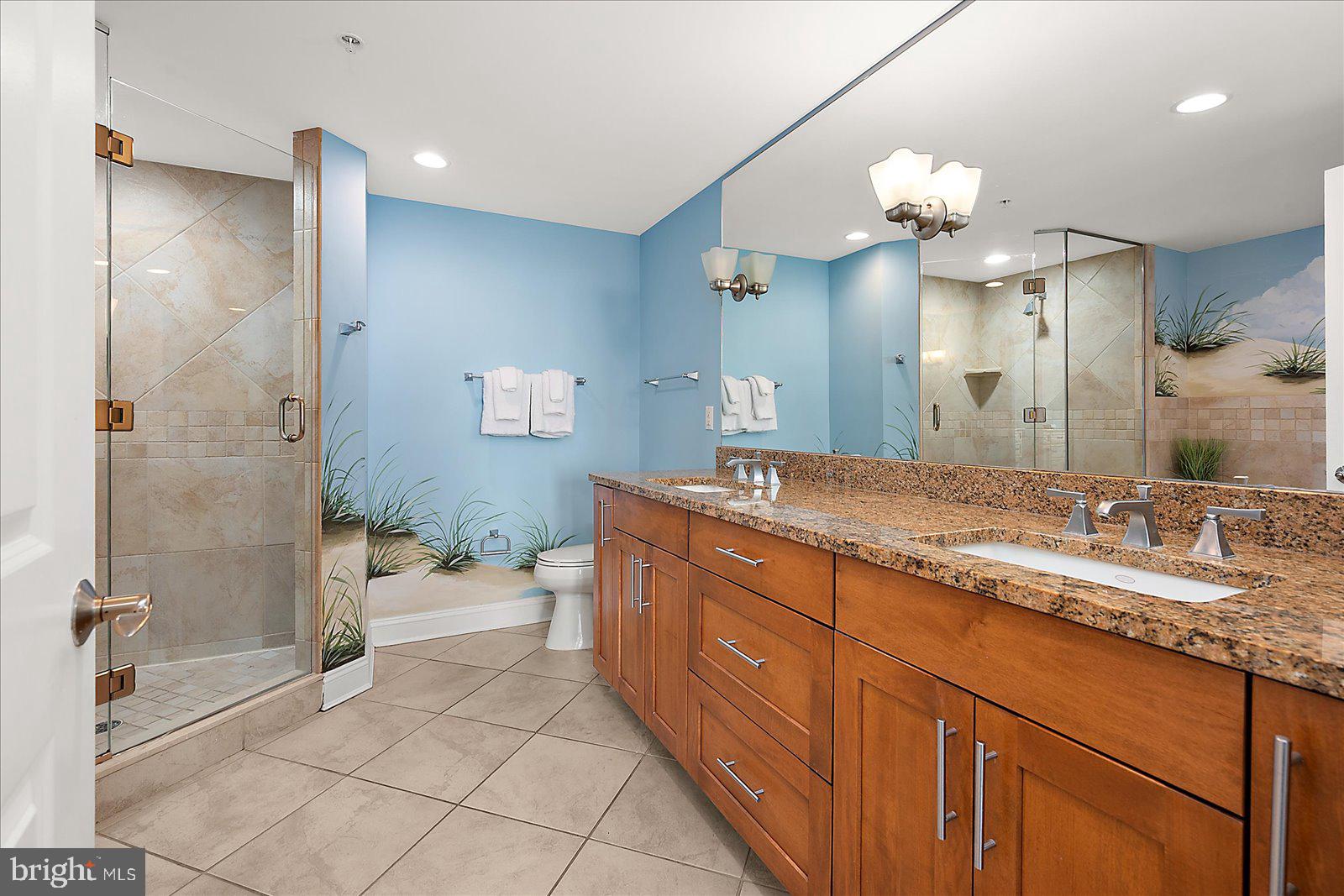 8 60th Street, Unit 902 Ocean City, MD 21842 - Photo 33 of 67 a spacious bathroom with a granite countertop sink a toilet and shower