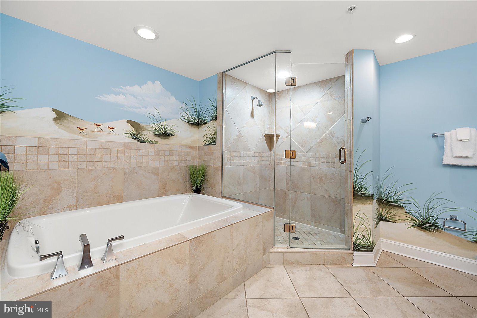 8 60th Street, Unit 902 Ocean City, MD 21842 - Photo 34 of 67 a bathroom with a bathtub and a shower