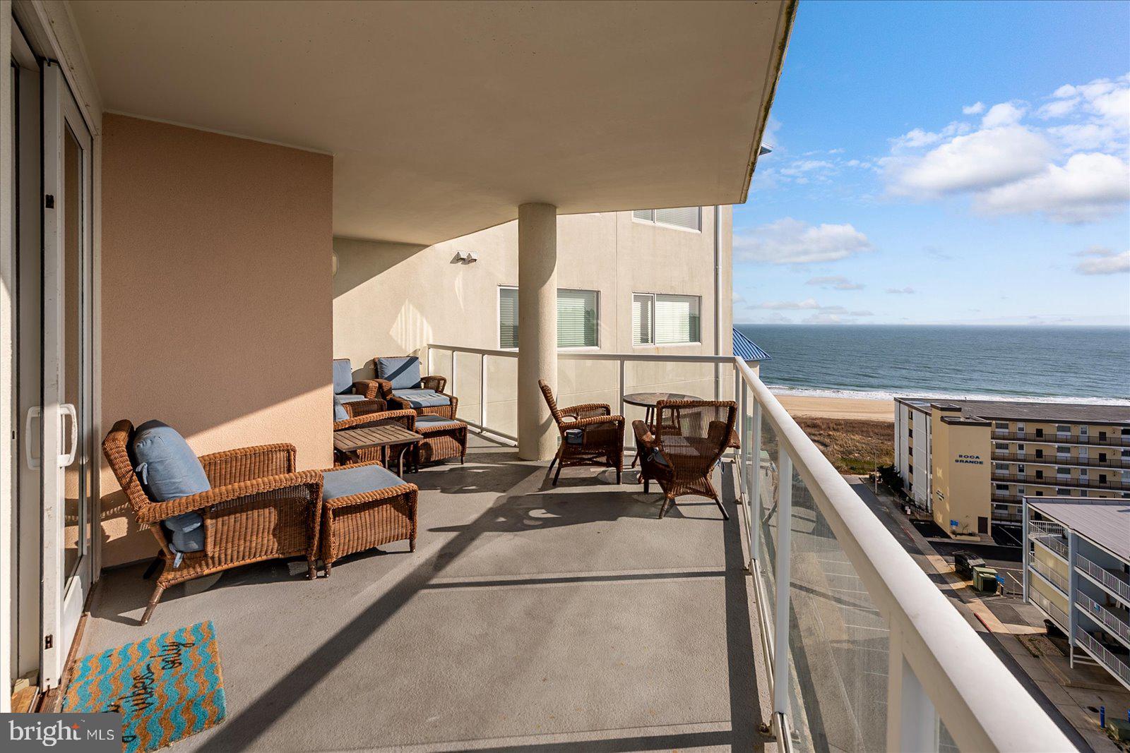 8 60th Street, Unit 902 Ocean City, MD 21842 - Photo 46 of 67 a balcony with chairs and outdoor view