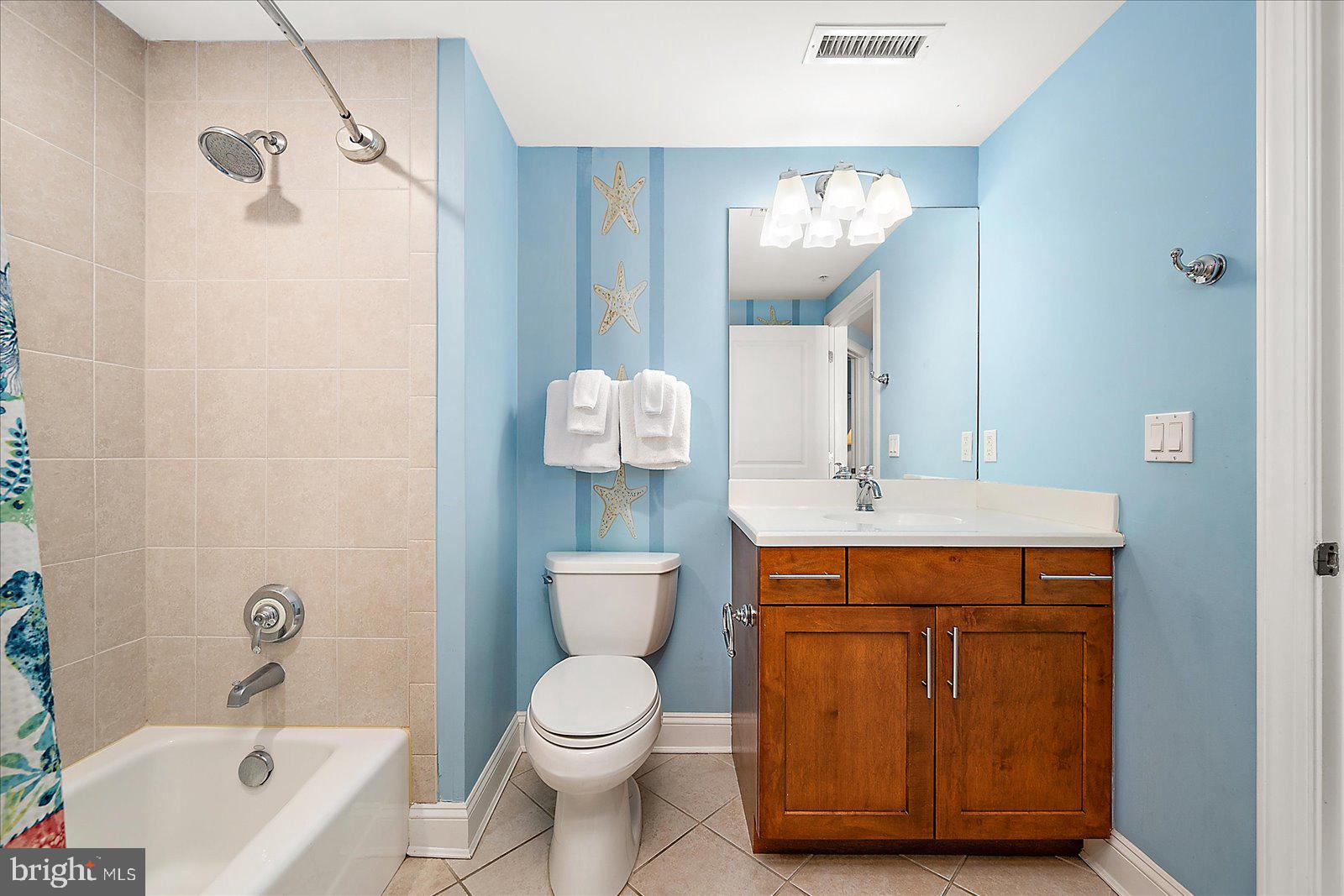 8 60th Street, Unit 902 Ocean City, MD 21842 - Photo 65 of 67 a bathroom with a sink a toilet and shower