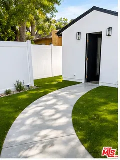 a view of a back yard of the house