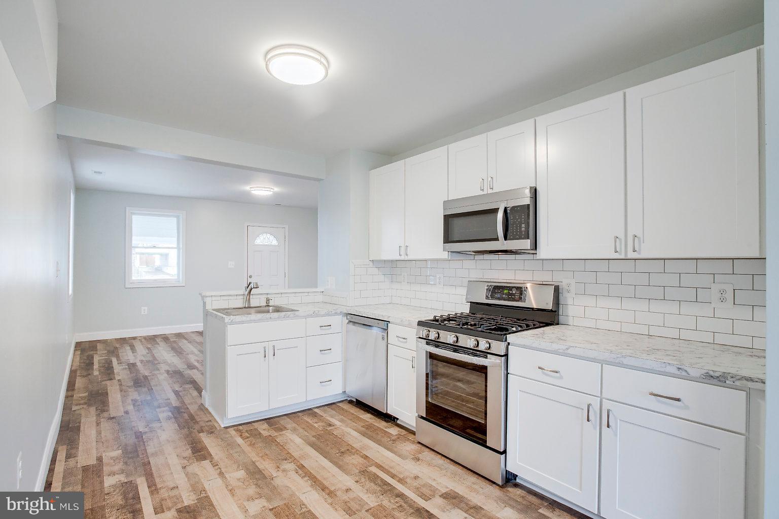 2706 West Woodwell Road Baltimore, MD 21222 - Photo 11 of 25 Kitchen, subway tile