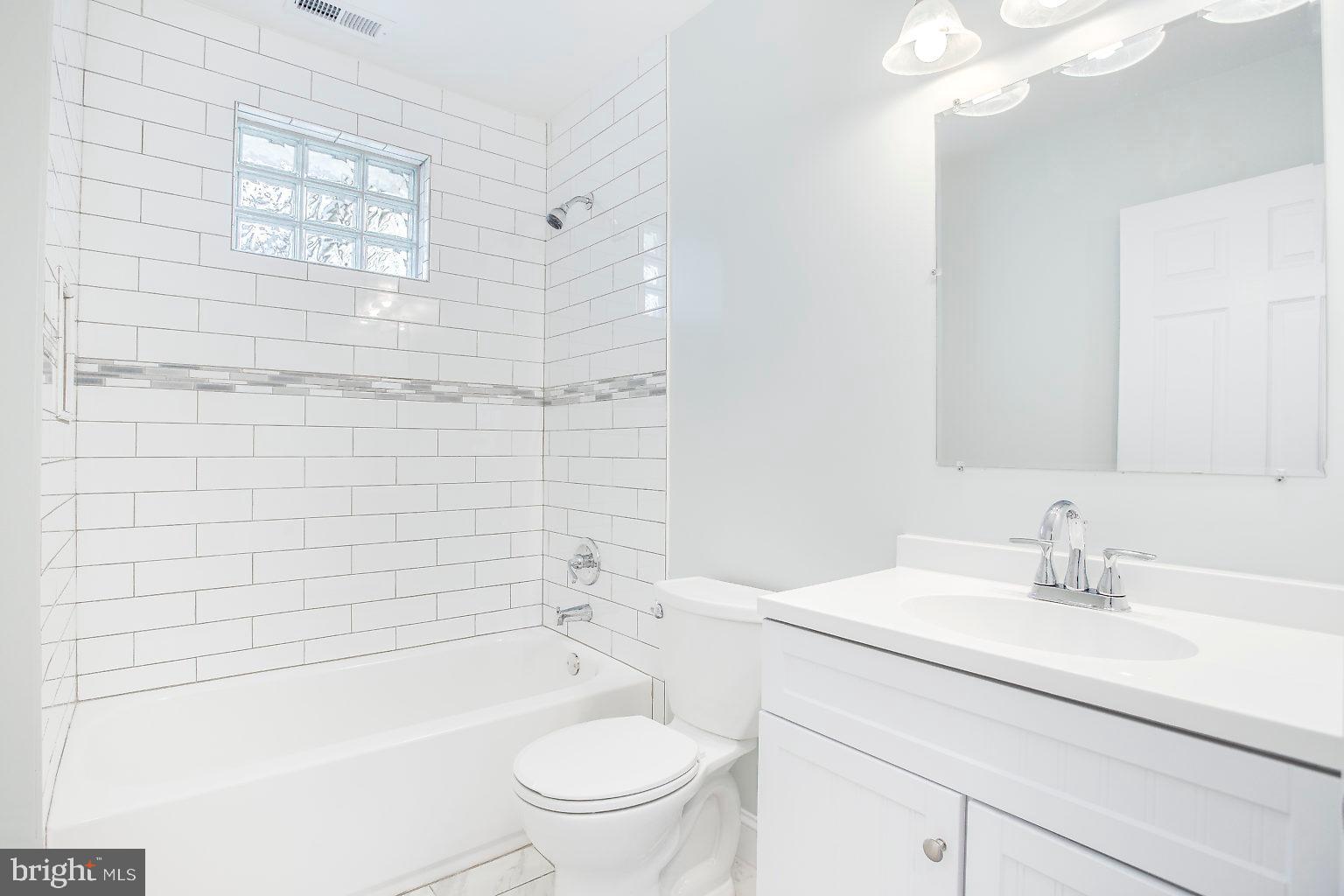 2706 West Woodwell Road Baltimore, MD 21222 - Photo 16 of 25 Tiled bathroom