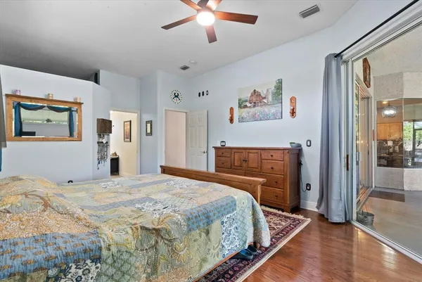 a bedroom with bed and a window
