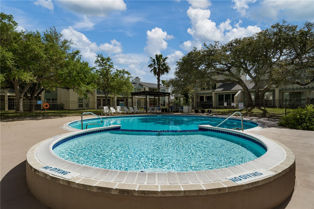 2003 North Fulton Beach Road, Unit 34 34 Rockport, TX 78382 - Photo 23 of 38 a view of a swimming pool with a yard