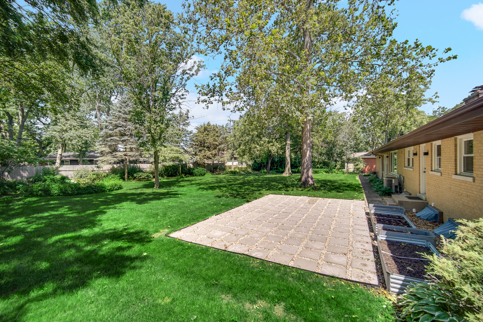 1006 Gardner Road Flossmoor, IL 60422 - Photo 27 of 33 a view of backyard with a garden and trees