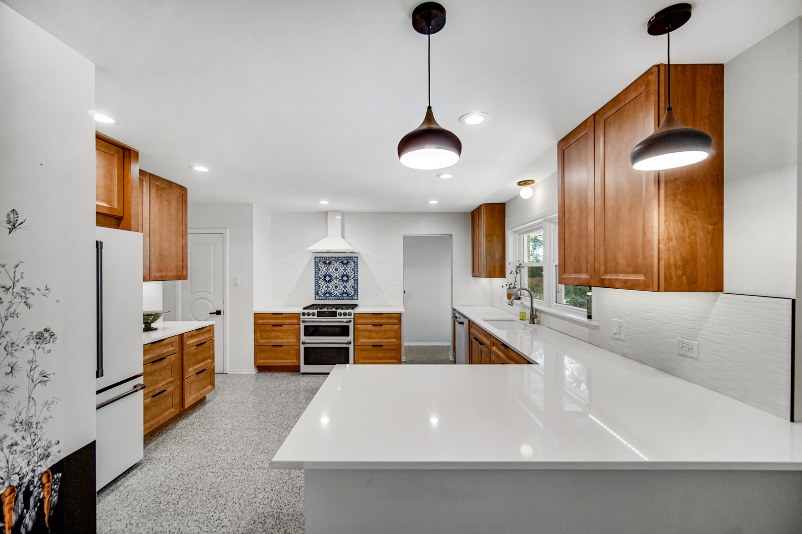 1006 Gardner Road Flossmoor, IL 60422 - Photo 8 of 33 a large kitchen with stainless steel appliances a stove a sink dishwasher a refrigerator and a dining table with wooden floor