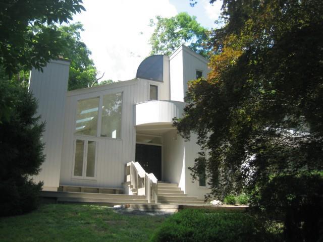 28 Sachem Road Weston, CT 06883 - Photo 1 of 1 a front view of a house with garden