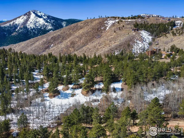 a view of a city with mountains in the background