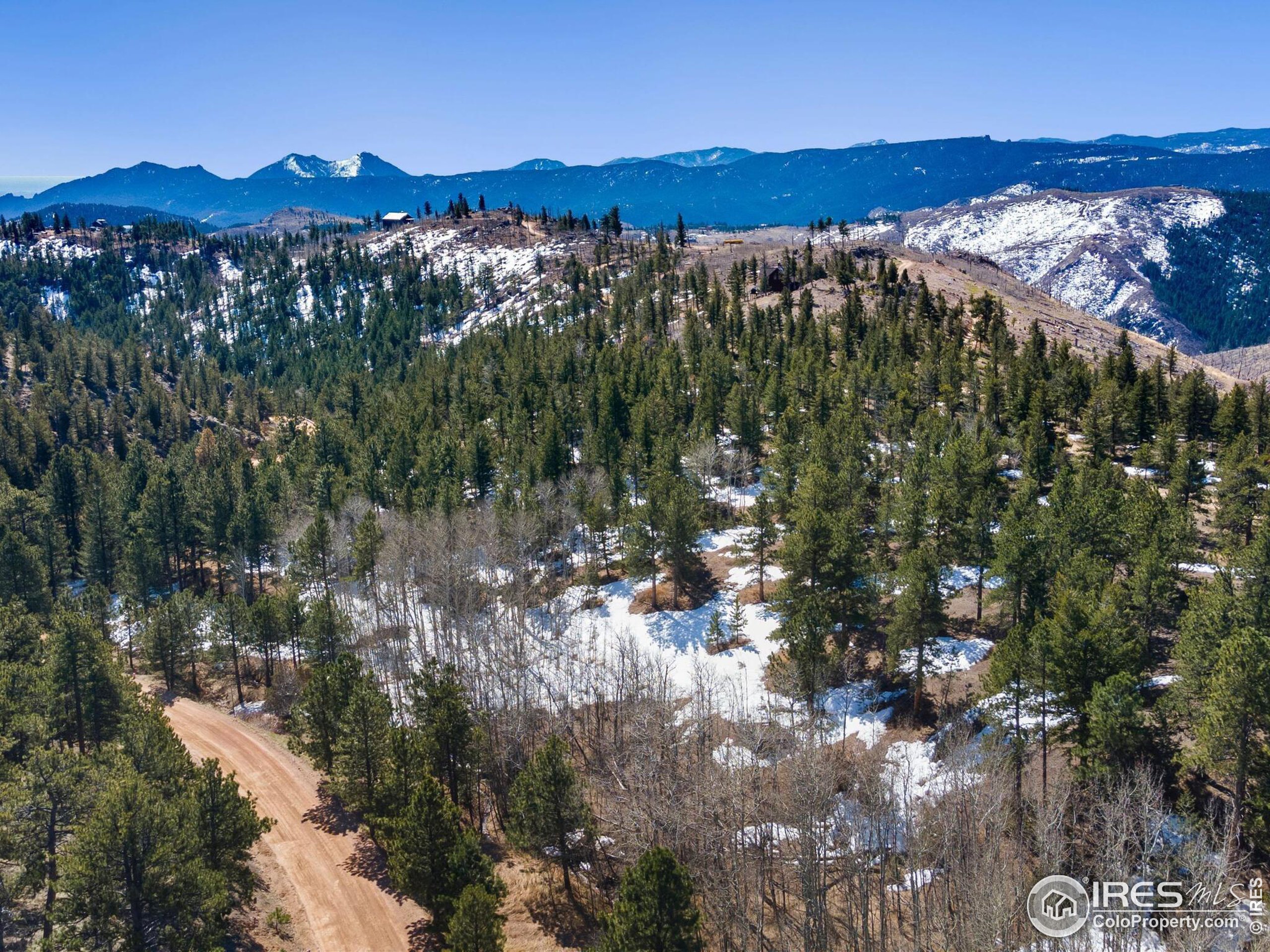 61 Rim Road Boulder, CO 80302 - Photo 19 of 33 a view of a city with mountains in the background