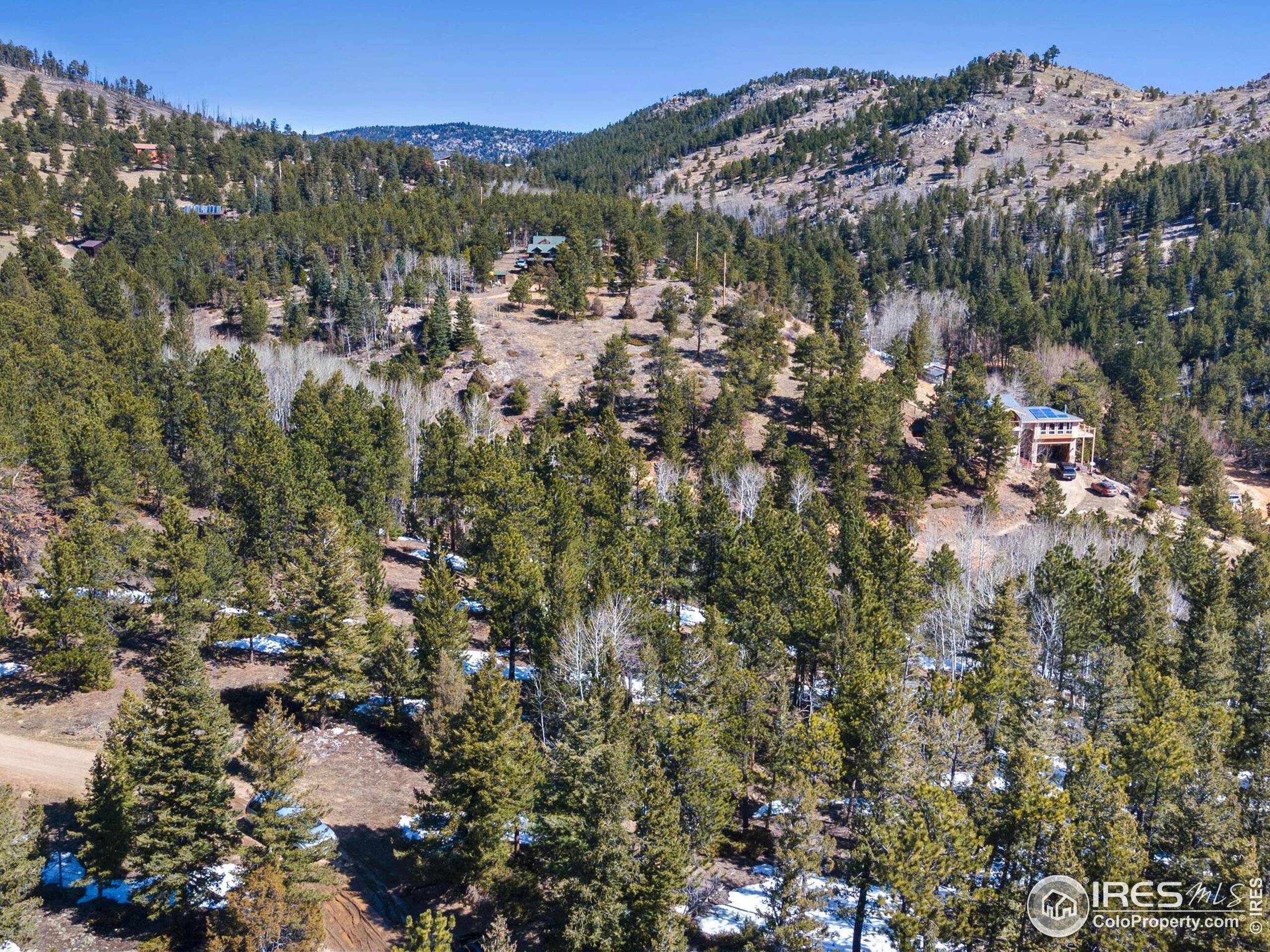 61 Rim Road Boulder, CO 80302 - Photo 10 of 33 a view of a lot of trees and houses