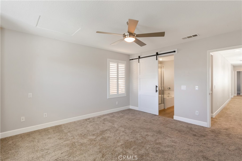 40116 Stowe Road Temecula, CA 92591 - Photo 24 of 53 Primary Bedroom w/ Barn Door