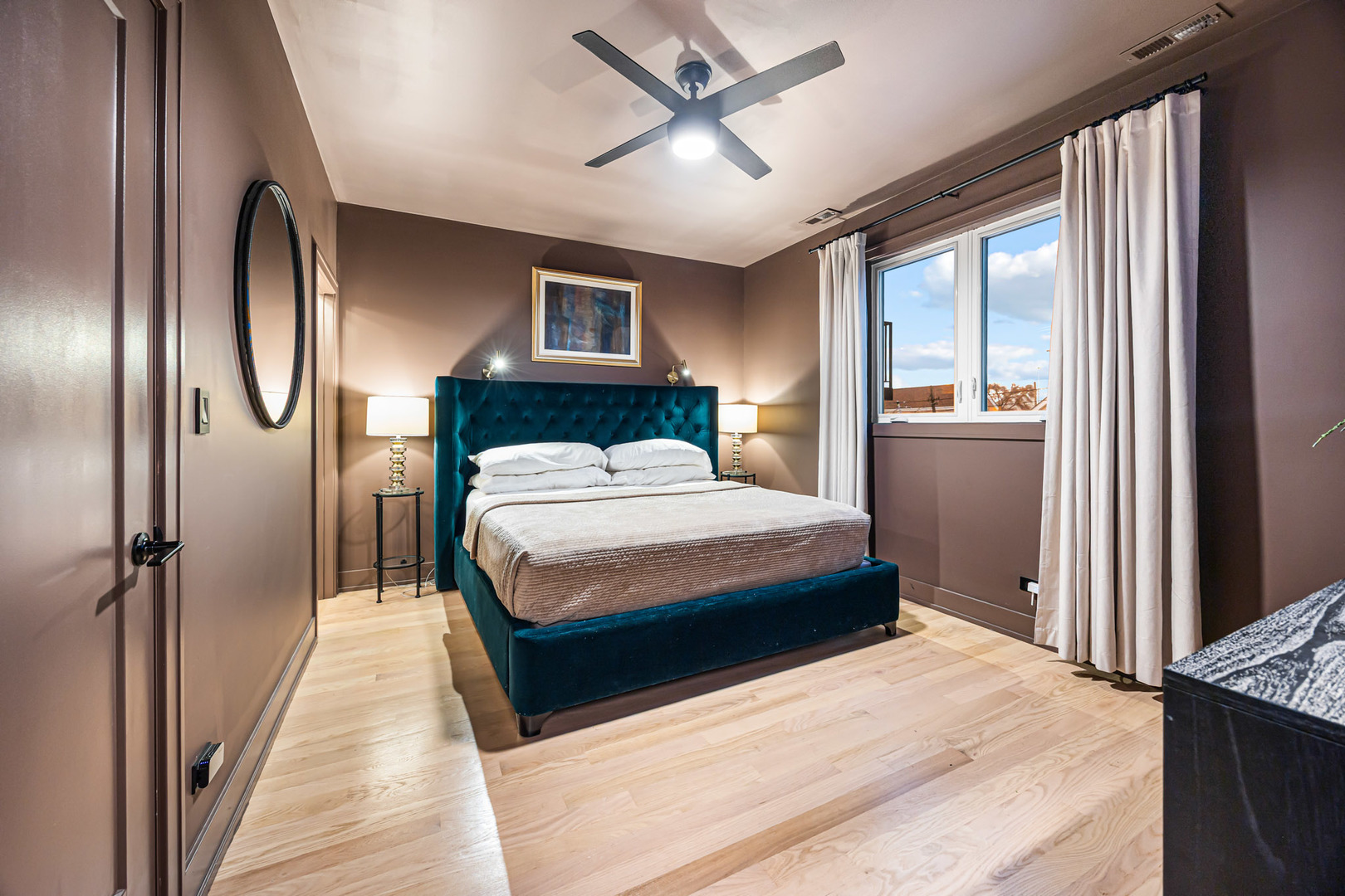 1738 West 17th Street, Unit 3 Chicago, IL 60608 - Photo 15 of 28 a bedroom with a large bed and a chandelier