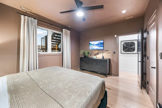 a bedroom with a bed and a table