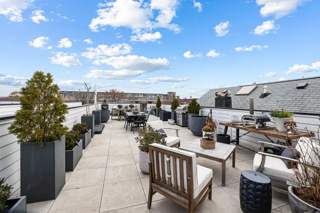 a view of a terrace with furniture and stove