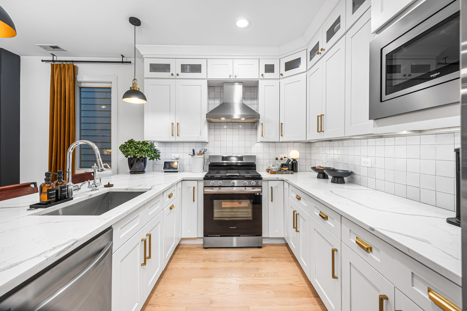 1738 West 17th Street, Unit 3 Chicago, IL 60608 - Photo 9 of 28 a kitchen with stainless steel appliances granite countertop a stove and a sink
