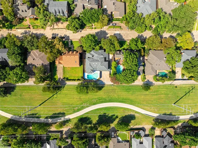 an aerial view of a house with a swimming pool