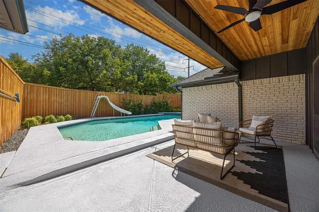 a view of backyard with seating space