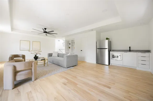 a large white bed in a white room