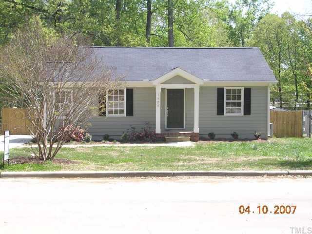 1826 Watkins Street Raleigh, NC 27604 - Photo 1 of 9 a front view of a house with a yard