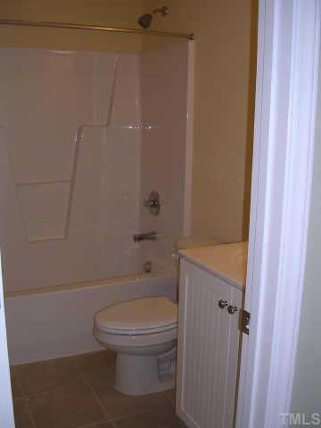 1826 Watkins Street Raleigh, NC 27604 - Photo 9 of 9 a white toilet sitting next to a shower