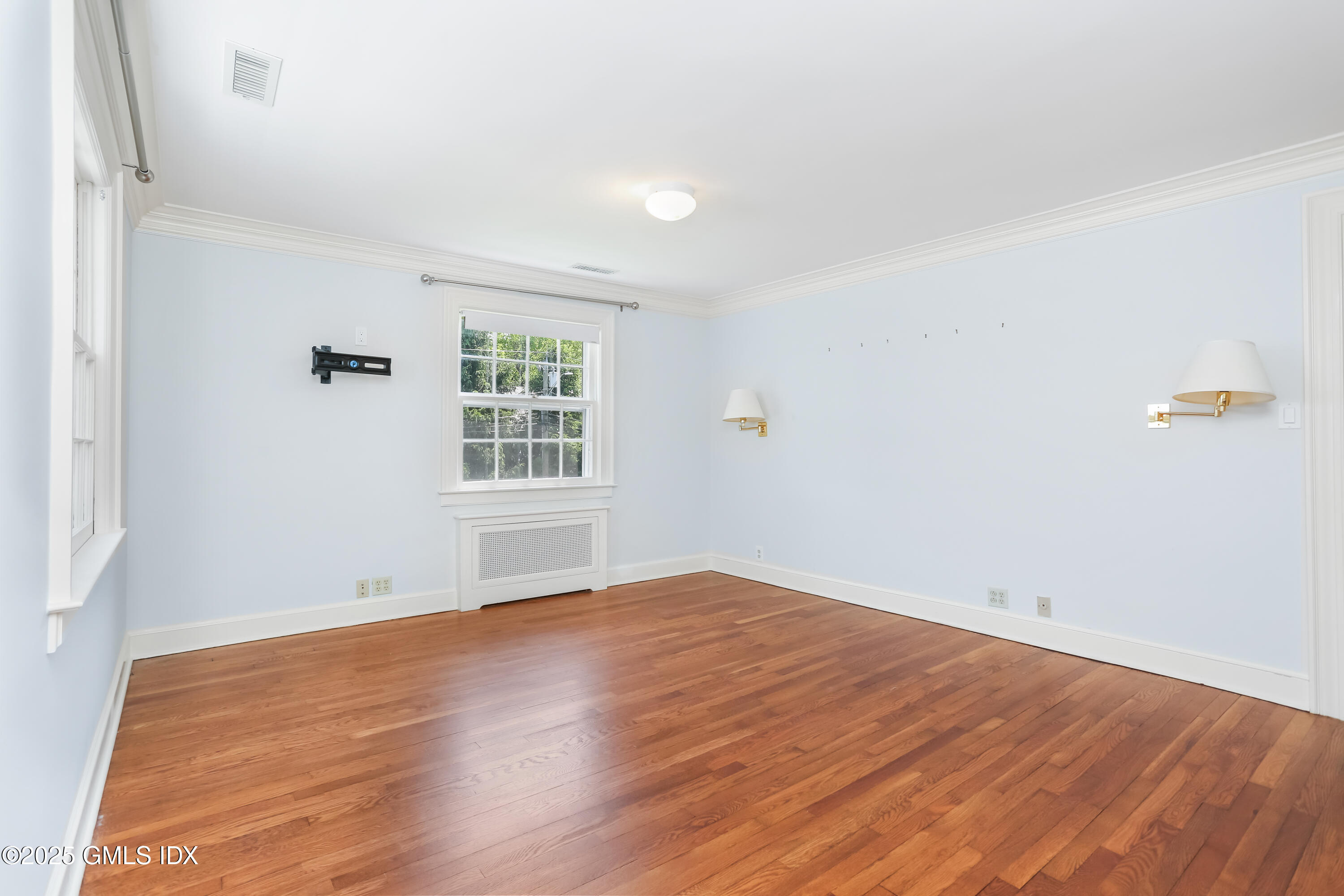 47 Winthrop Drive Riverside, CT 06878 - Photo 23 of 32 an empty room with wooden floor and windows
