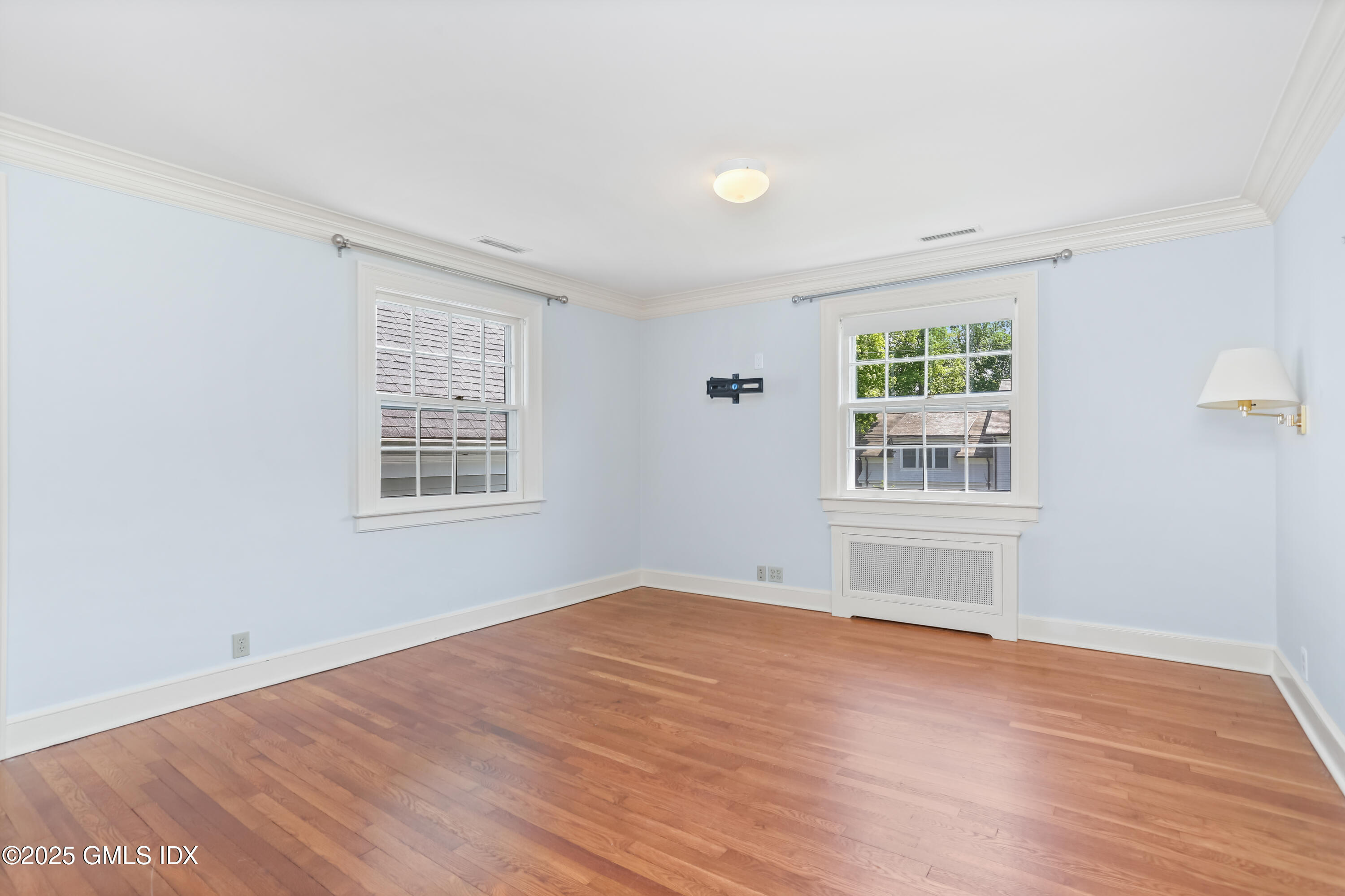 47 Winthrop Drive Riverside, CT 06878 - Photo 24 of 32 an empty room with wooden floor and windows