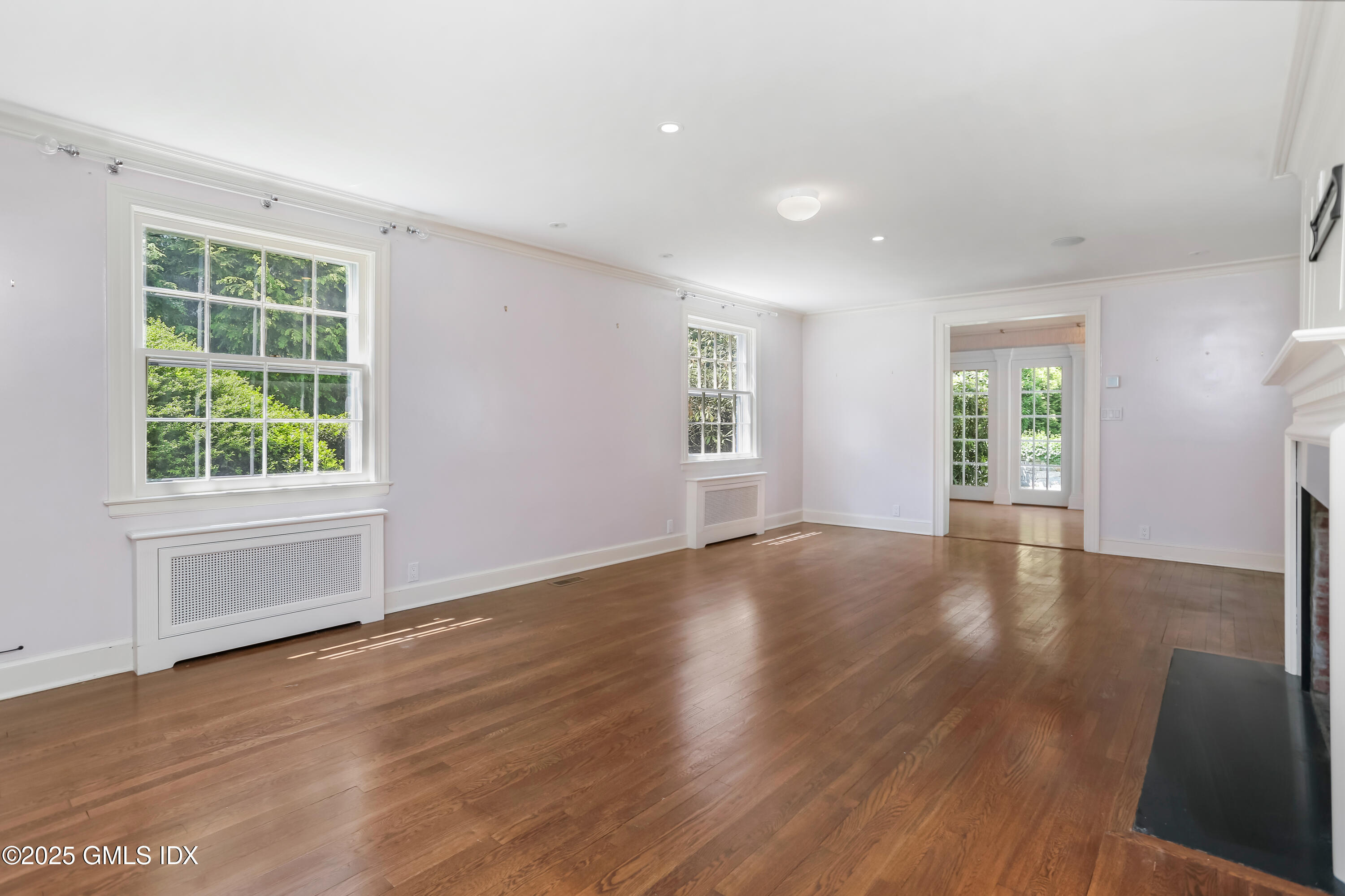 47 Winthrop Drive Riverside, CT 06878 - Photo 5 of 32 an empty room with wooden floor and windows
