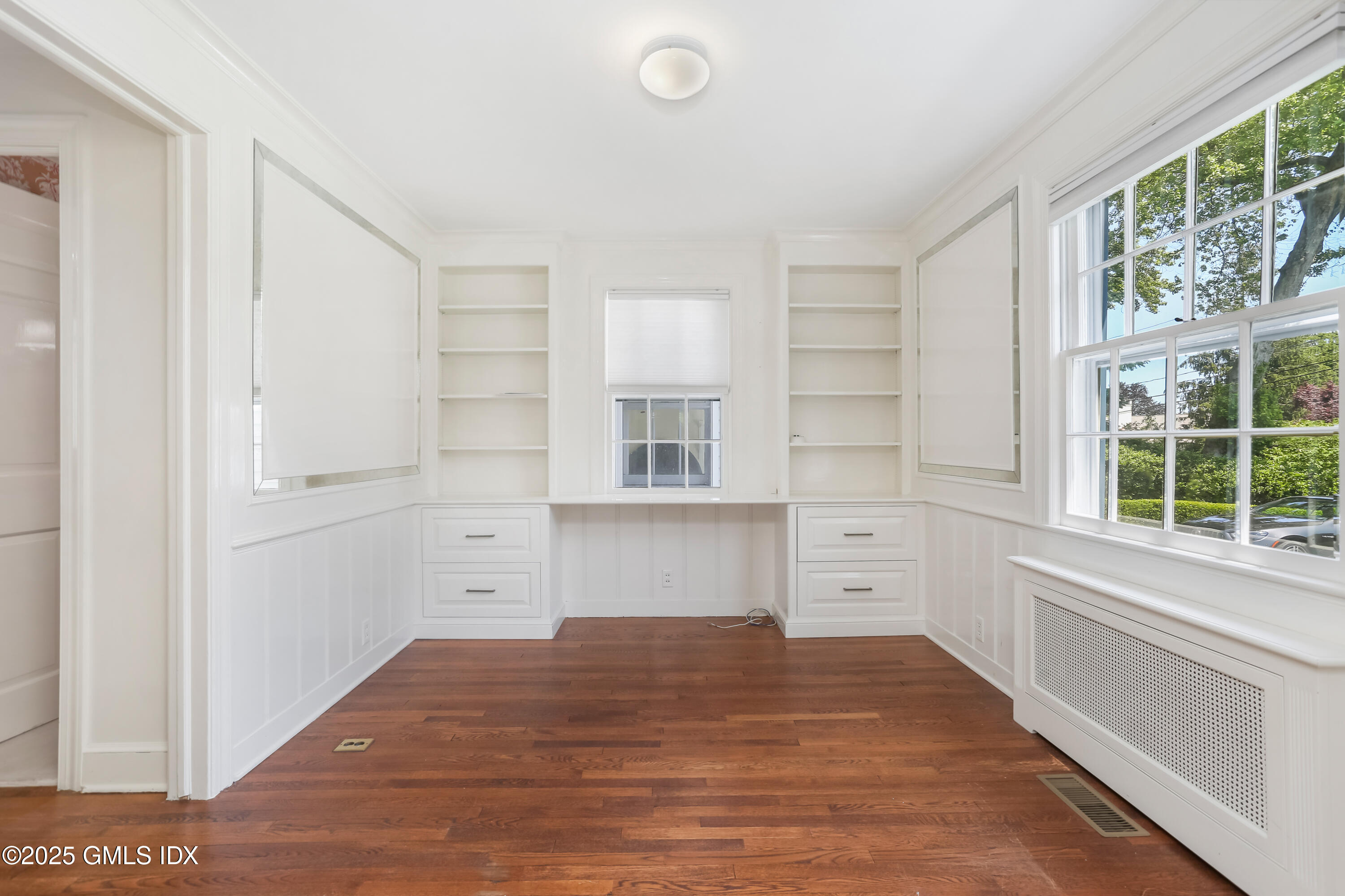 47 Winthrop Drive Riverside, CT 06878 - Photo 6 of 32 a room view with wooden floor and windows