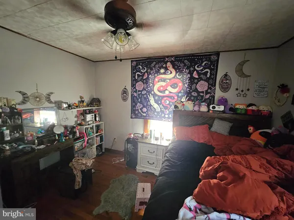 a utility room with dryer washer and a view of living room