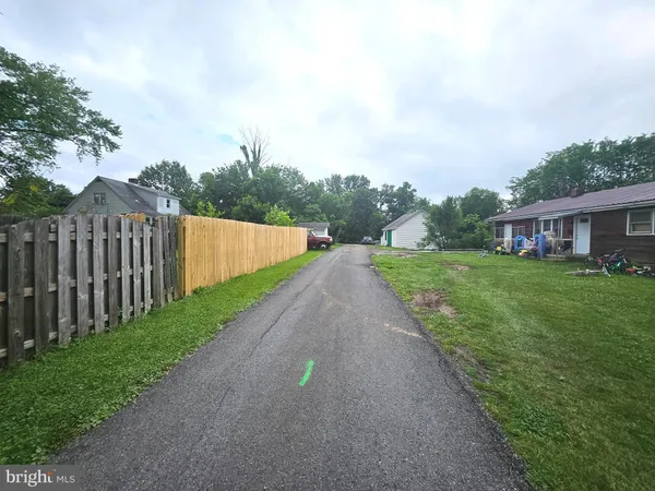 a bedroom with bed and a flat tv screen