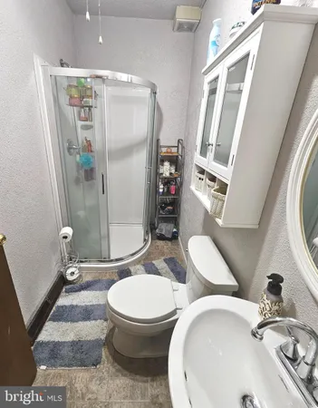 a bathroom with a tub and a sink