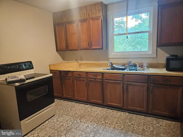 a kitchen with a stove and a microwave