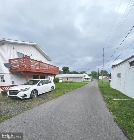 a view of a car in front of a house