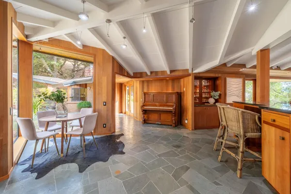 a view of a kitchen with furniture and windows