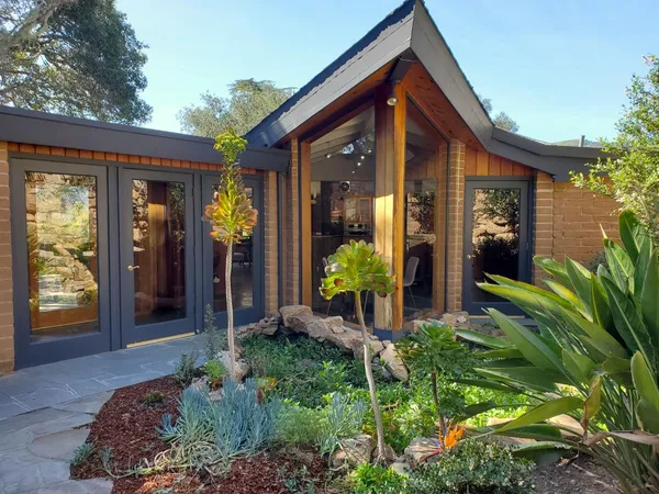 a spacious bedroom with a bed and a couch