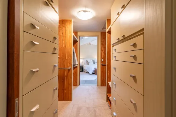 a spacious bedroom with a bed and a window