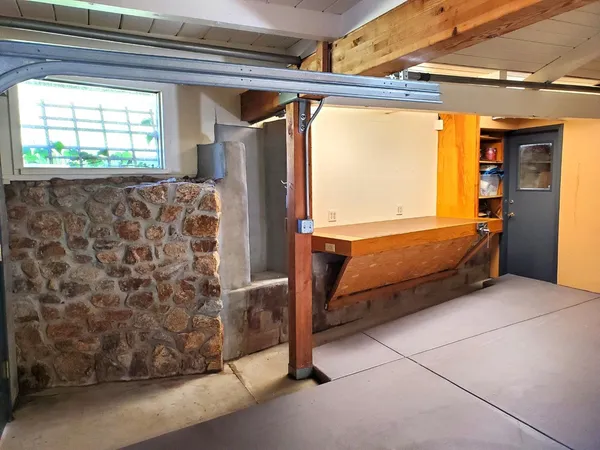 a view of a pathway with a wrought fence