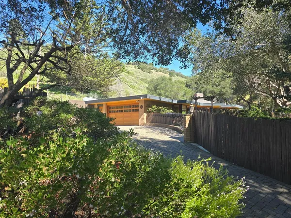a picture of a room with a white wall and a window