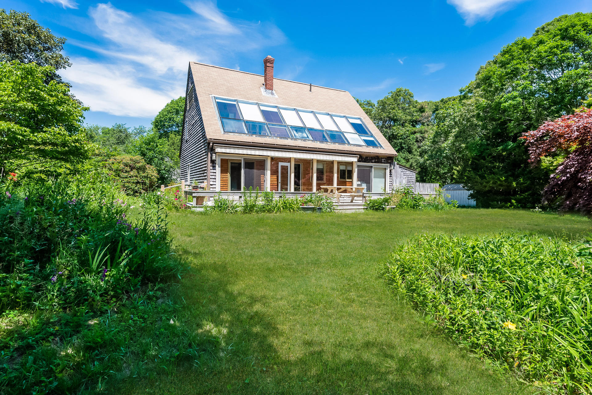 164 Samoset Road Eastham, MA 02642 - Photo 1 of 43 a front view of house with yard and green space