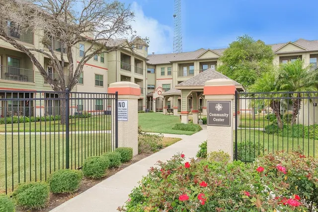 a front view of a house with a garden and pathway