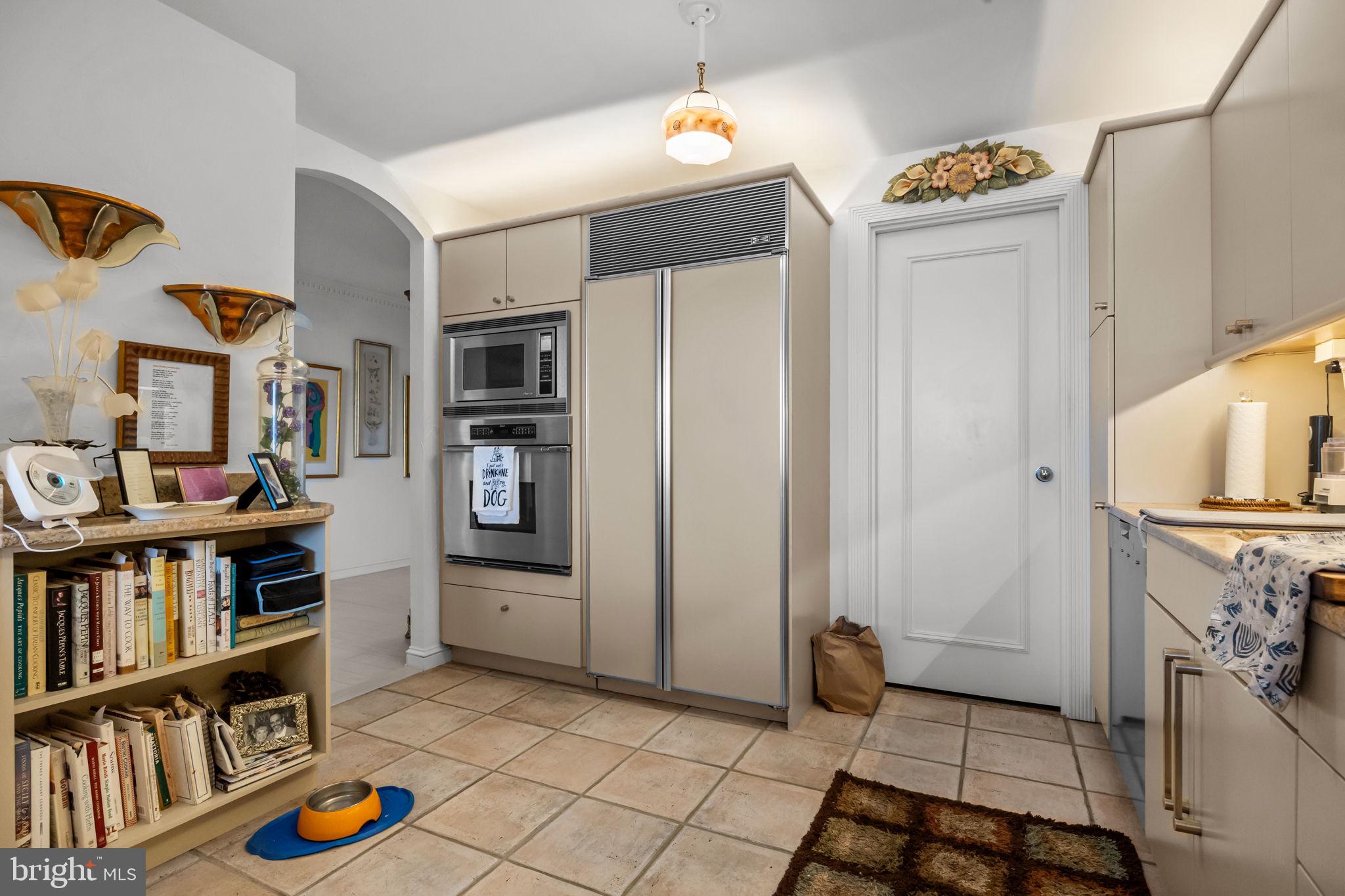 202 West Rittenhouse Square, Unit 2608 Philadelphia, PA 19103 - Photo 14 of 35 a living room with furniture and a book shelf