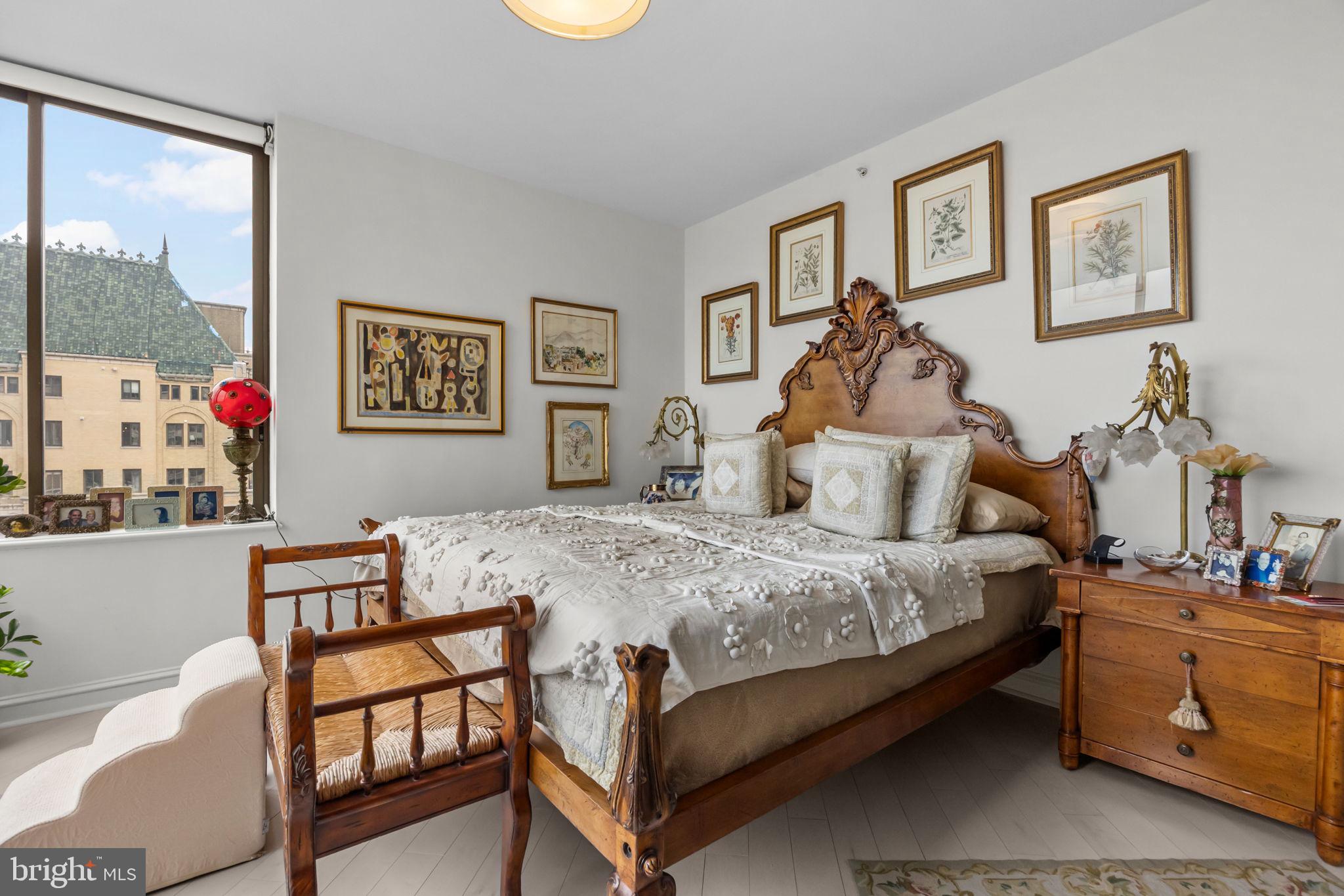 202 West Rittenhouse Square, Unit 2608 Philadelphia, PA 19103 - Photo 16 of 35 a bedroom with a bed and wooden floor