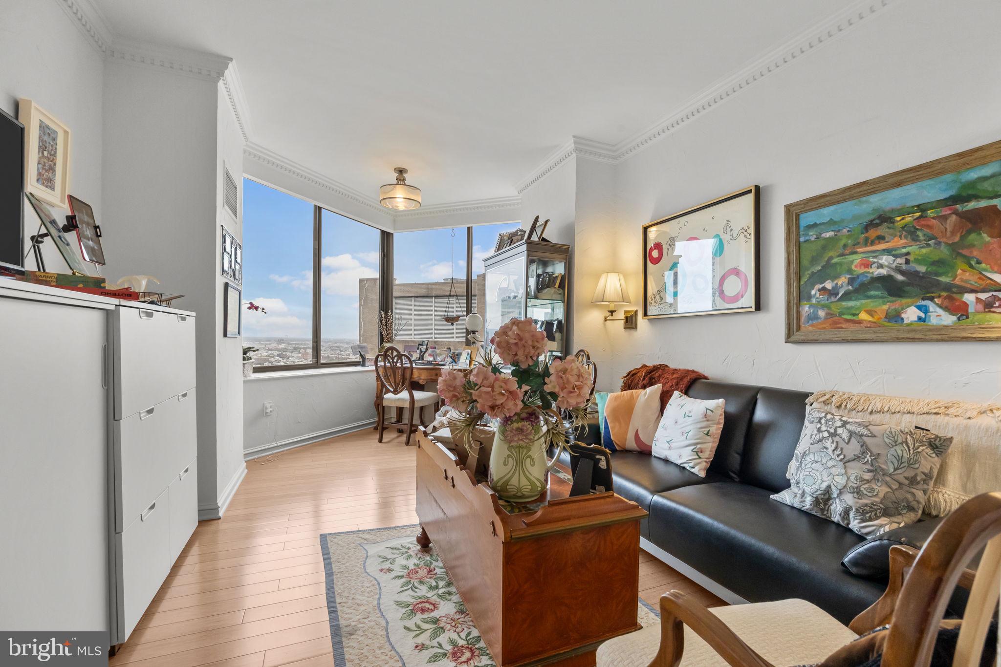 202 West Rittenhouse Square, Unit 2608 Philadelphia, PA 19103 - Photo 18 of 35 a living room with furniture and a large window