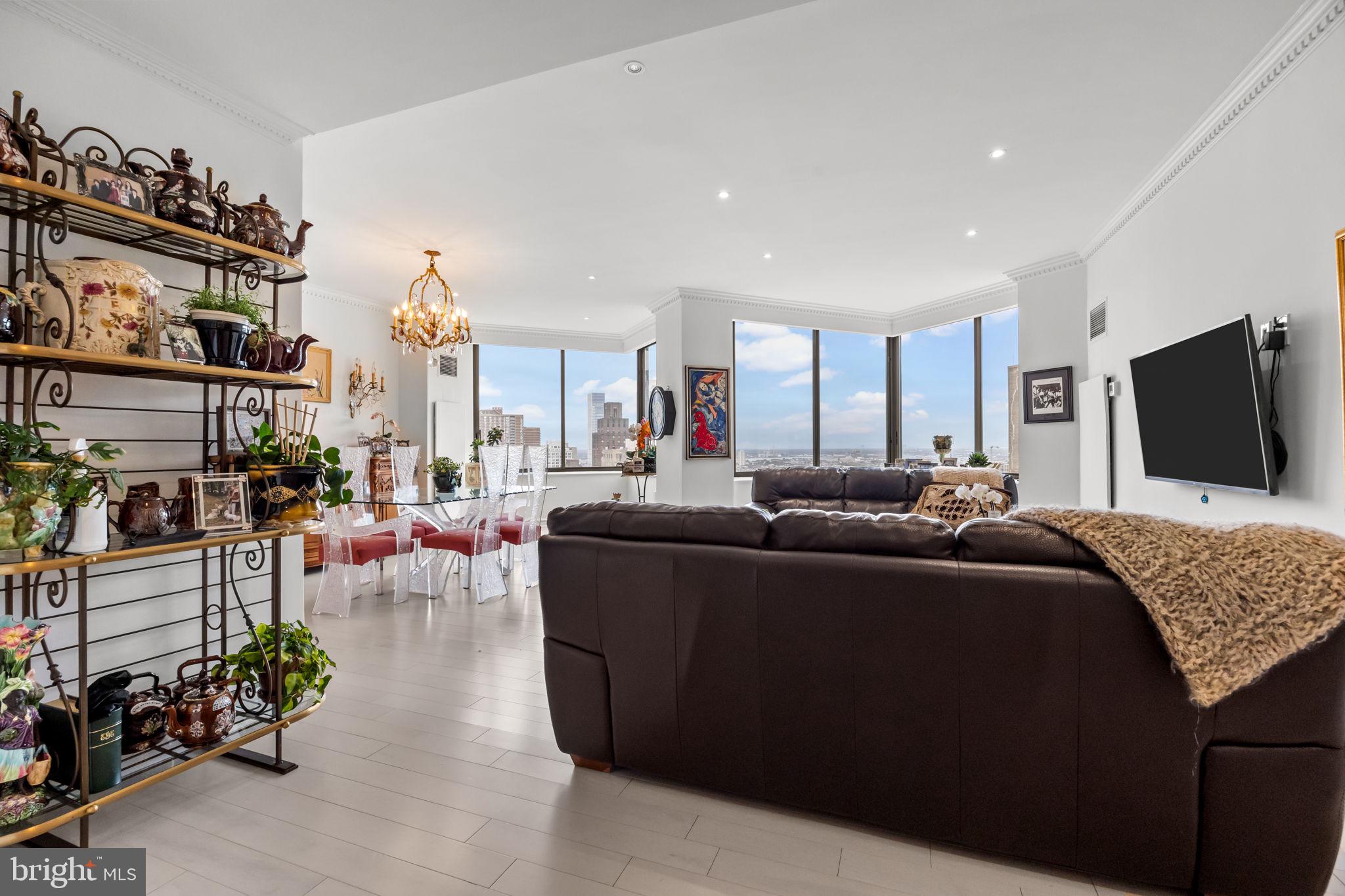 202 West Rittenhouse Square, Unit 2608 Philadelphia, PA 19103 - Photo 4 of 35 a living room with furniture and a flat screen tv